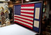 Framing a 3' x 5' American Flag with two documents.  This is one way of displaying the full flag with other documents in the same shadowbox style frame.  On the back we reinforced it.